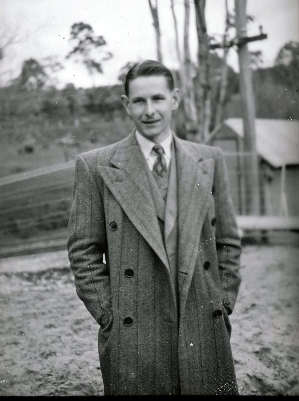 Dennis Evans in an overcoat.